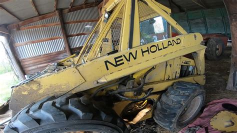 how to remove hydraulic cylinder for skid steer|new holland lift cylinder removal.